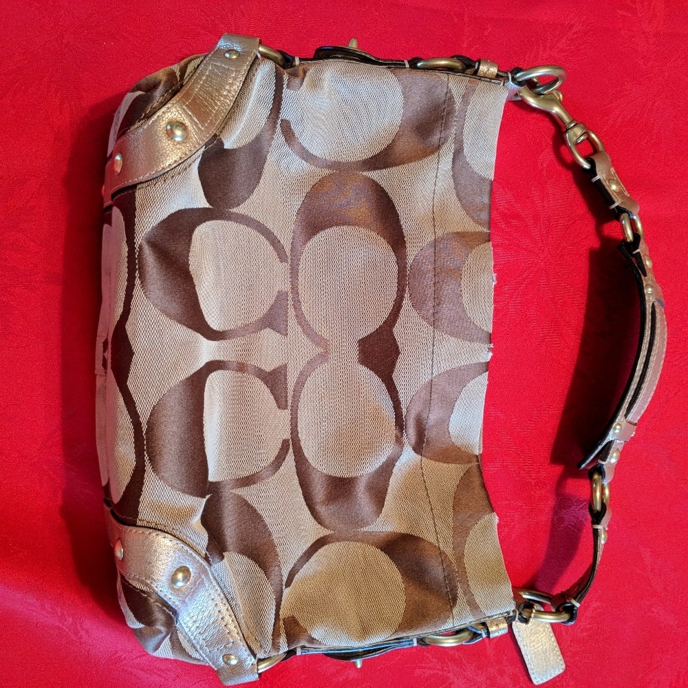 Coach, medium sized gently used purse. Gold & tan